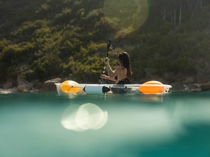 Young woman kayaking in sea at F ZEEN KEFALONIA